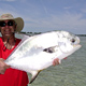 Denis with a beautiful Permit caught on the ocean side flats