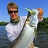 Will Anderton with his favorite thing to catch, the baby tarpon - with a DOA CAL Jerk Bait