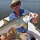 Eric Becker with a baby tarpon on fly