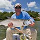 Jon with a baby tarpon on the fly