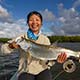 Lili with a baby tarpon on the fly!