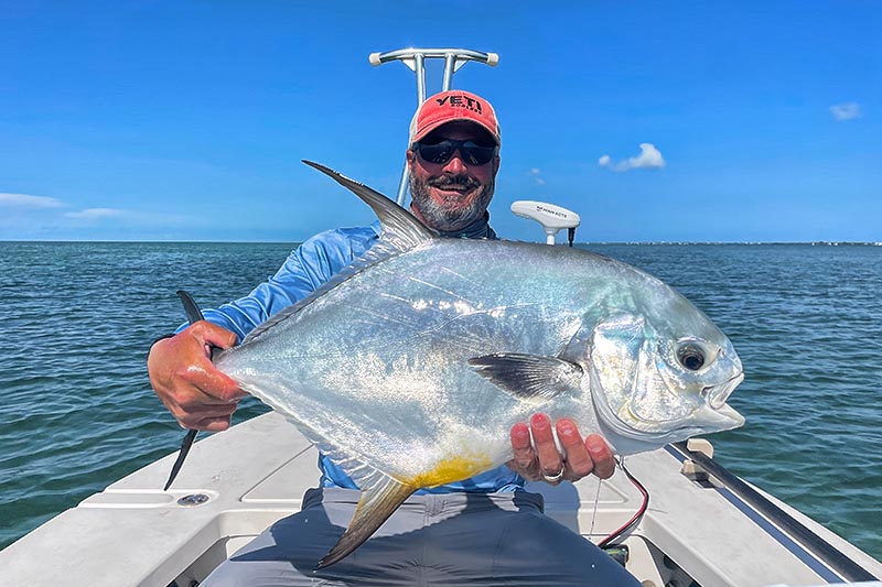 Caleb with a nice oceanside Permit